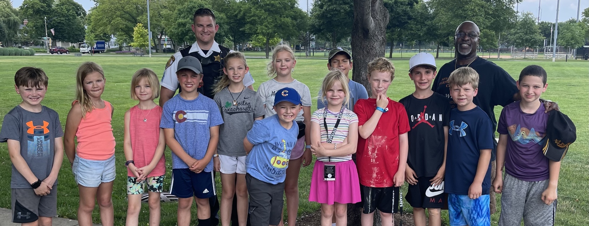 Group of youth campers with community mentors at an SPAA USA-sponsored CSI Camp gathering.